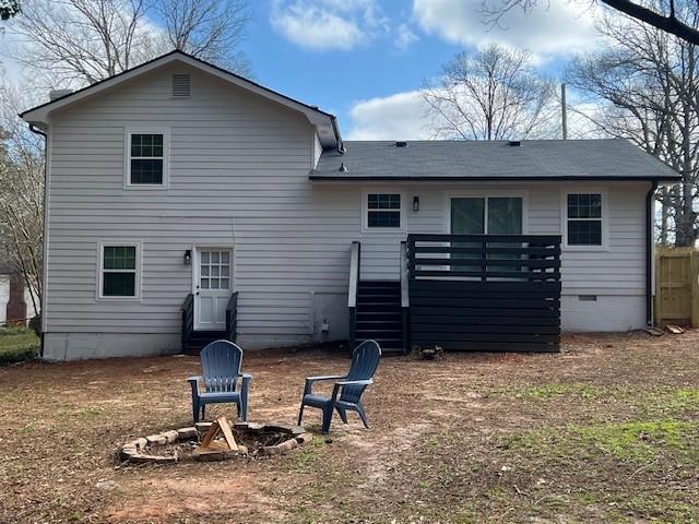 5990 Wellborn Trace Lithonia, GA 30058 - Photo 46 of 56 a backyard of a house with table and chairs