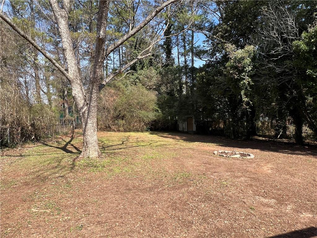 5990 Wellborn Trace Lithonia, GA 30058 - Photo 48 of 56 a view of empty space and tree