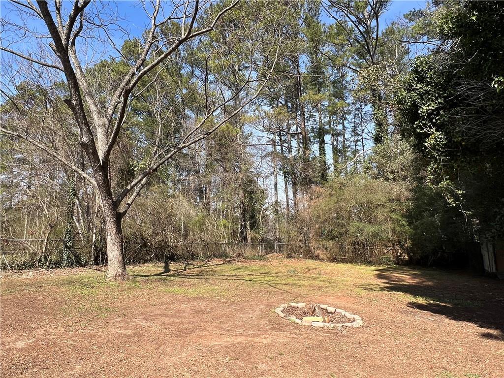 5990 Wellborn Trace Lithonia, GA 30058 - Photo 51 of 56 a view of a yard with trees