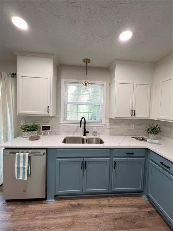 5990 Wellborn Trace Lithonia, GA 30058 - Photo 6 of 56 a kitchen with a sink and cabinets