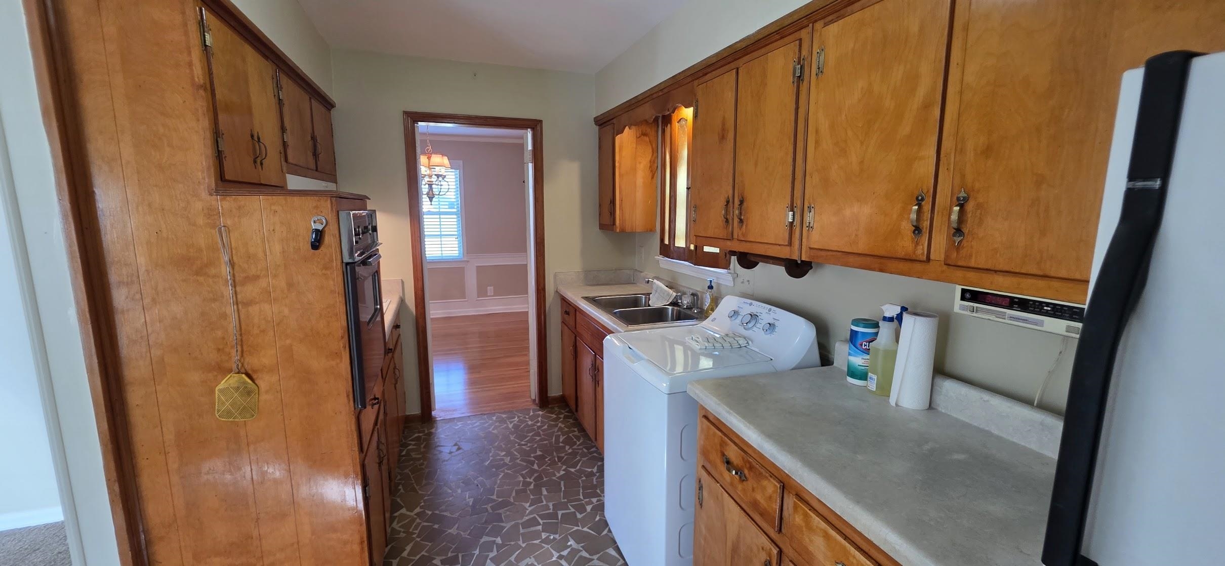 523 Shofner Avenue Memphis, TN 38109 - Photo 5 of 12 Laundry area featuring washer / clothes dryer and cabinet space