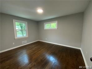 11900 Deerhurst Drive Midlothian, VA 23113 - Photo 31 of 33 an empty room with wooden floor and windows