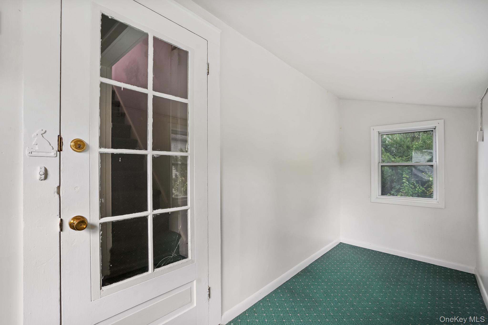 211 Pomeroy Street Peekskill, NY 10566 - Photo 32 of 50 Sun/Mud room on second floor with access to stairs to the back of the house from patio.