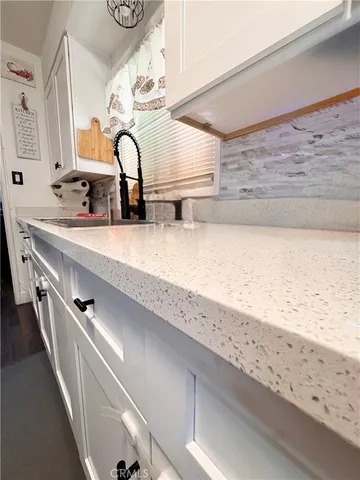 a bathroom with a sink and mirror