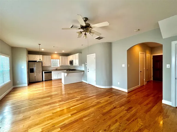 a view of a kitchen with a sink and cabinet
