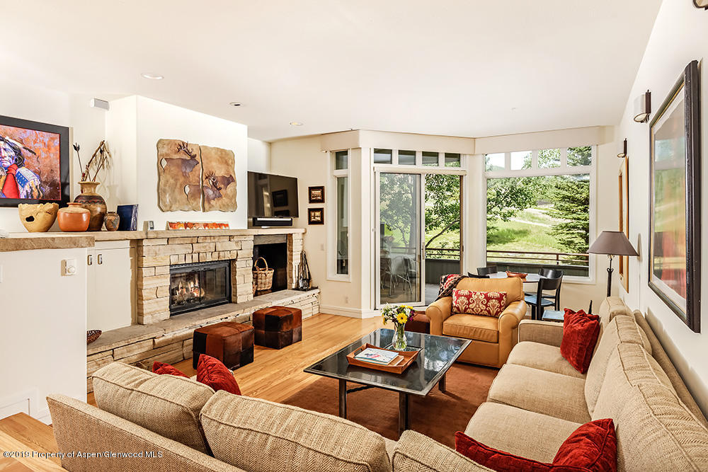 381 Ridge Road, Unit B2 Snowmass Village, CO 81615 - Photo 4 of 27 Living Room with Wood Burning Fireplace