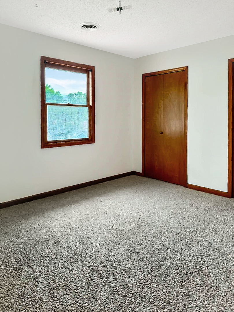 1008 Ascot Drive Rantoul, IL 61866 - Photo 19 of 24 an empty room with windows