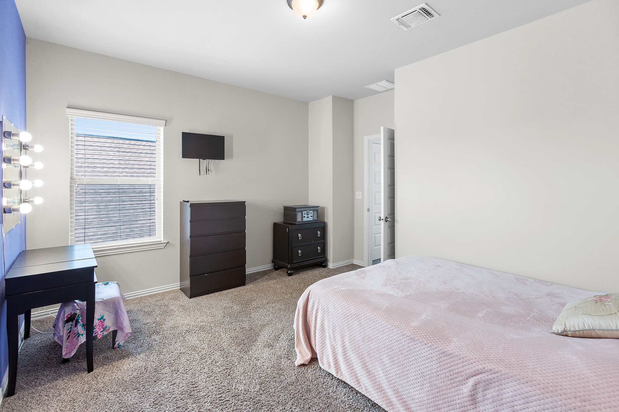 8709 Slater Drive Austin, TX 78747 - Photo 27 of 36 a bedroom with a bed and a window