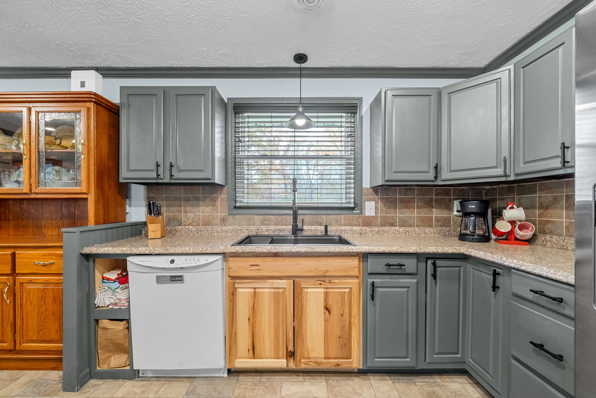 2126 Foster Road Cumberland Furnace, TN 37051 - Photo 13 of 42 a kitchen with stainless steel appliances granite countertop a sink stove and cabinets