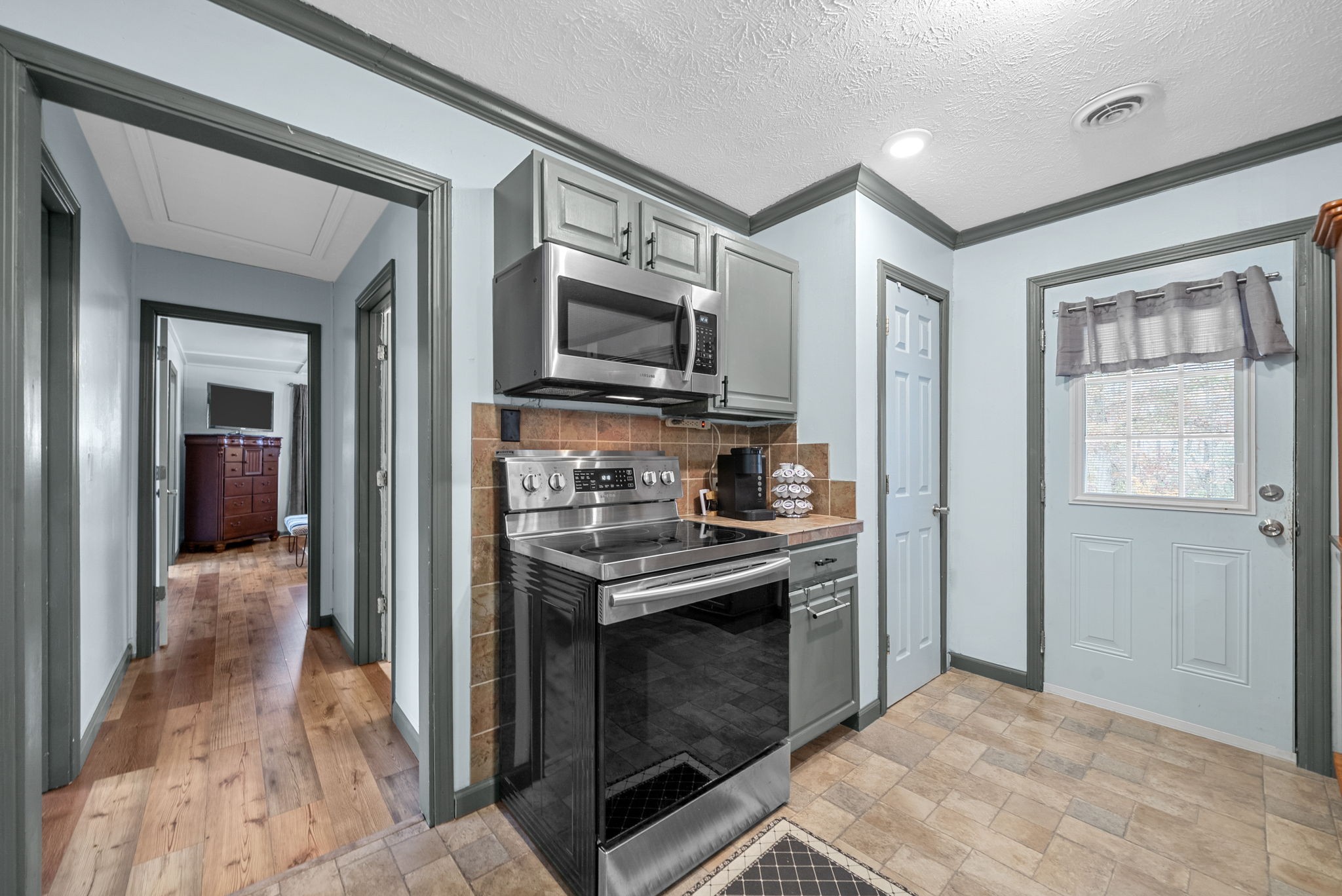 2126 Foster Road Cumberland Furnace, TN 37051 - Photo 16 of 42 a kitchen with stainless steel appliances granite countertop a stove and a refrigerator