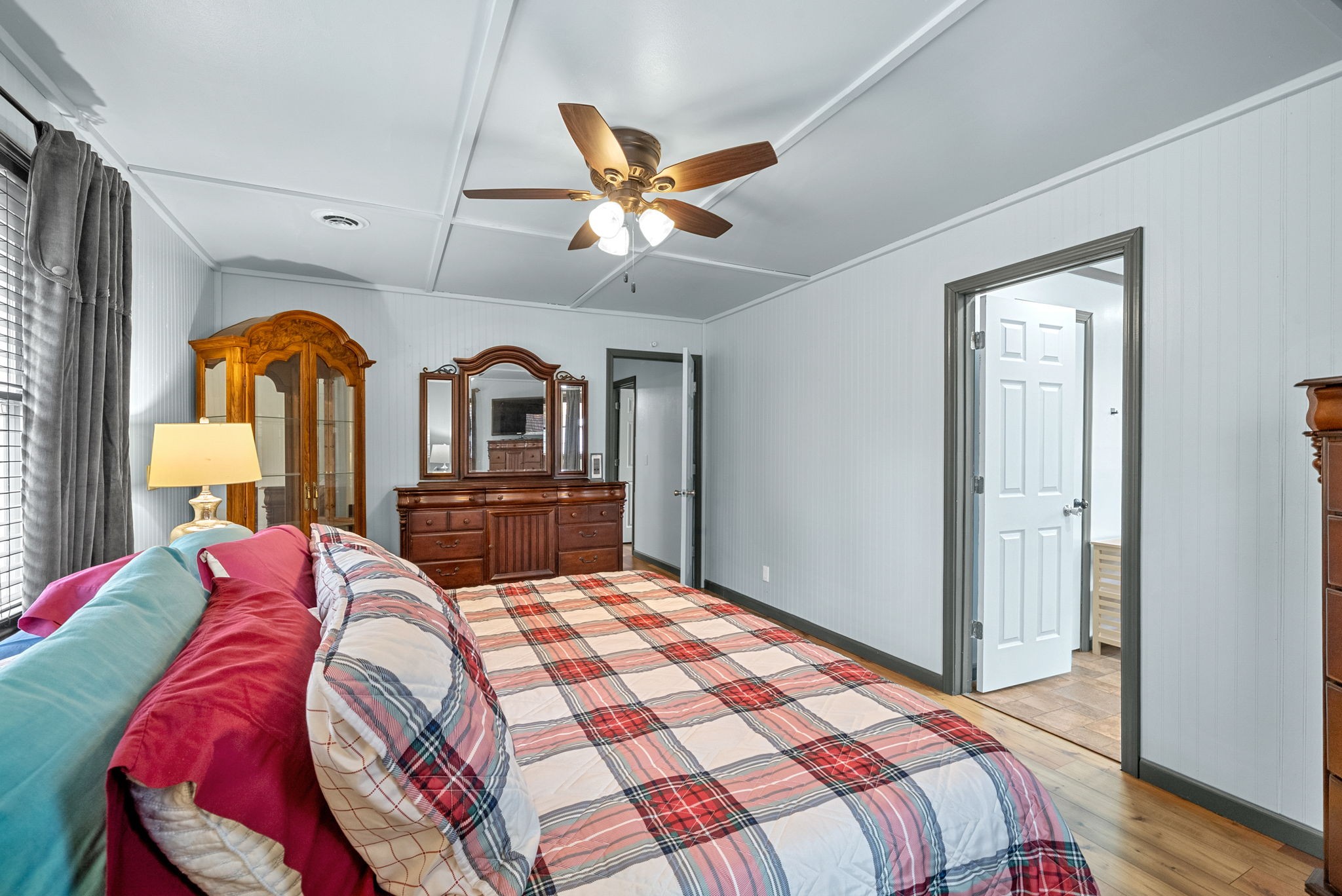 2126 Foster Road Cumberland Furnace, TN 37051 - Photo 19 of 42 a bedroom with a large bed and a chandelier