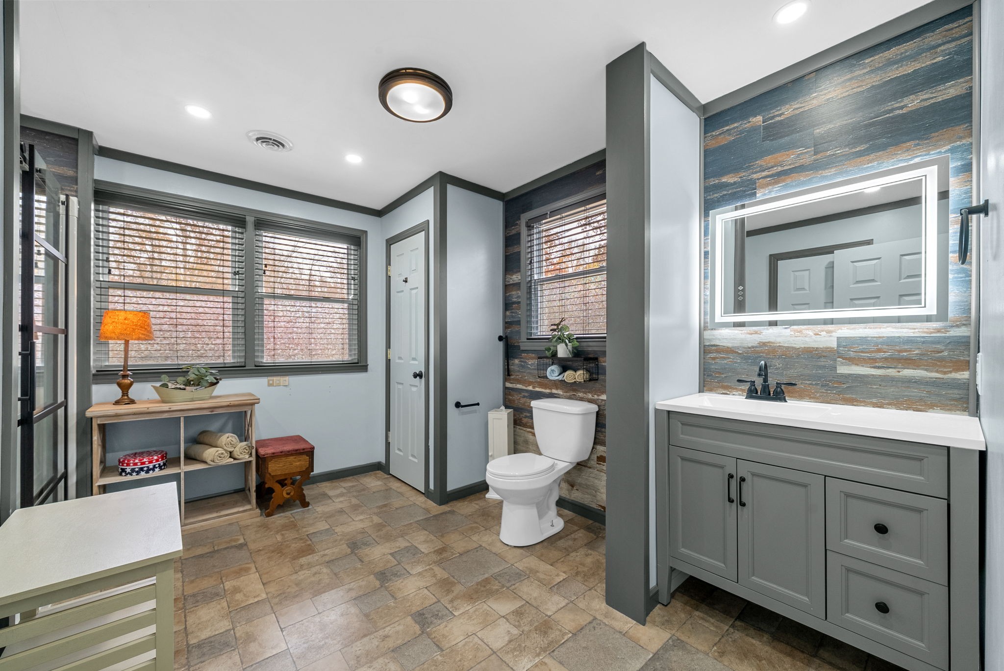 2126 Foster Road Cumberland Furnace, TN 37051 - Photo 20 of 42 a spacious bathroom with a double vanity sink a mirror and a bathtub