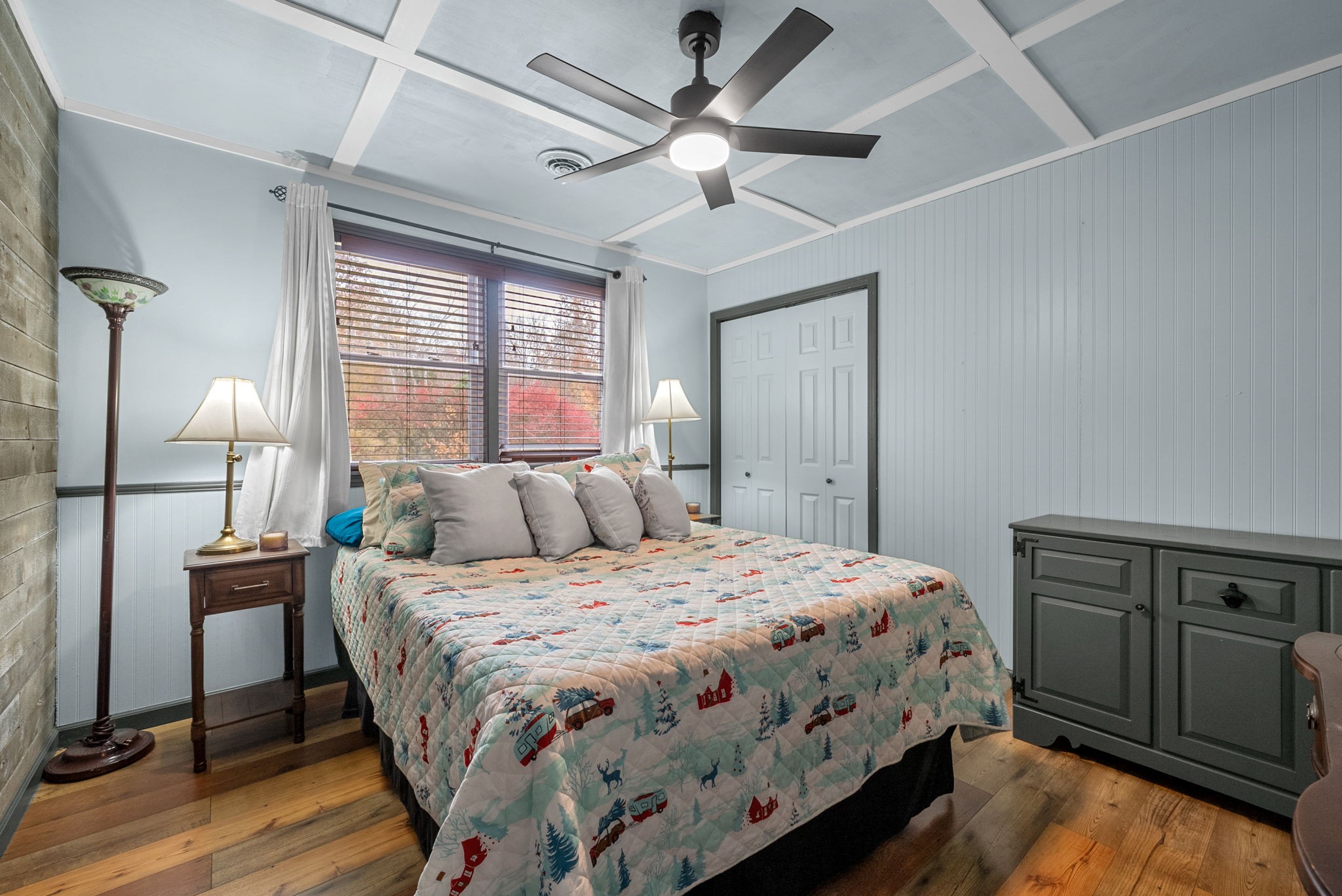 2126 Foster Road Cumberland Furnace, TN 37051 - Photo 23 of 42 a bedroom with a bed and a table with wooden floor