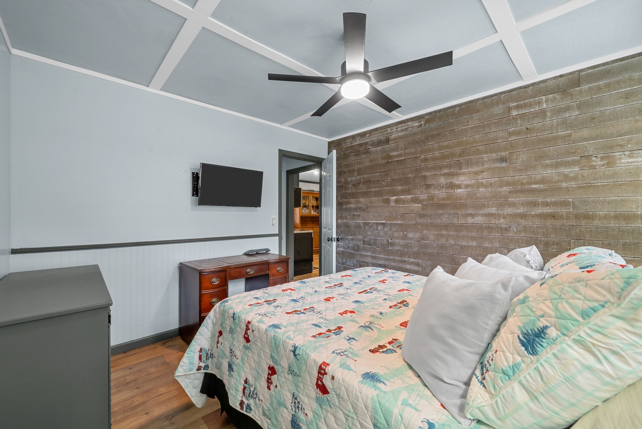 2126 Foster Road Cumberland Furnace, TN 37051 - Photo 24 of 42 a bedroom with a bed and a flat screen tv