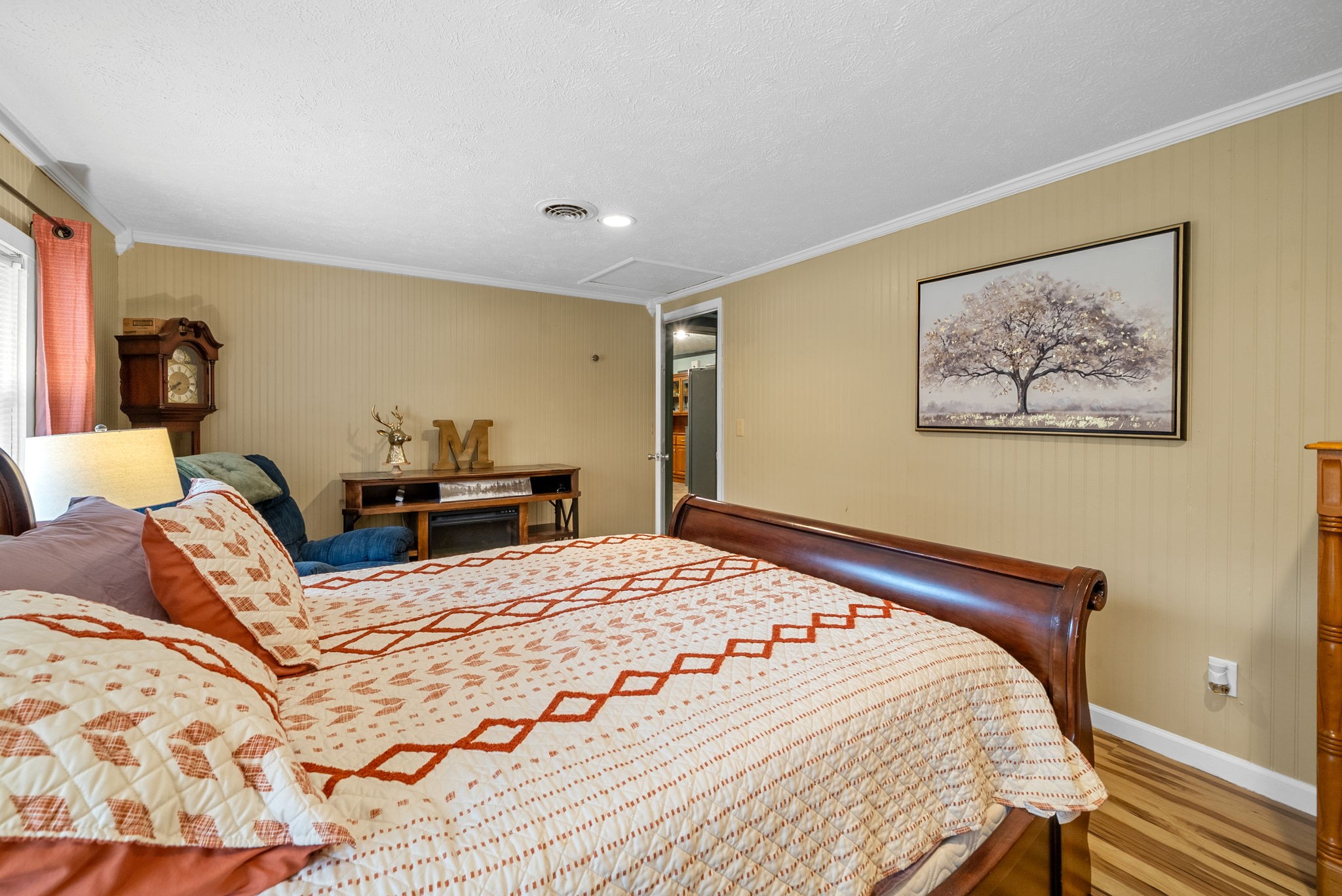 2126 Foster Road Cumberland Furnace, TN 37051 - Photo 27 of 42 a bedroom with a bed and a painting on the wall