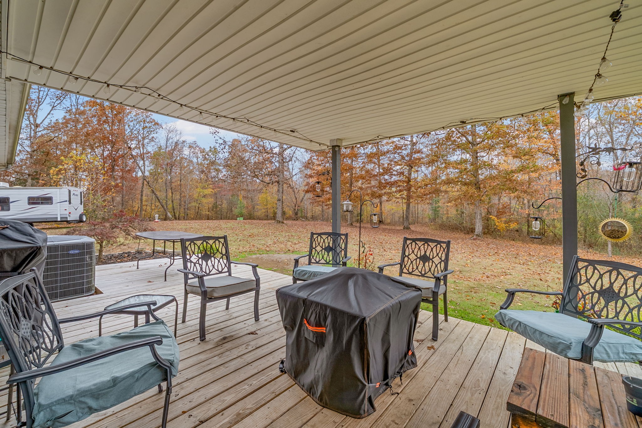 2126 Foster Road Cumberland Furnace, TN 37051 - Photo 32 of 42 a view of a patio with table and chairs and wooden floor