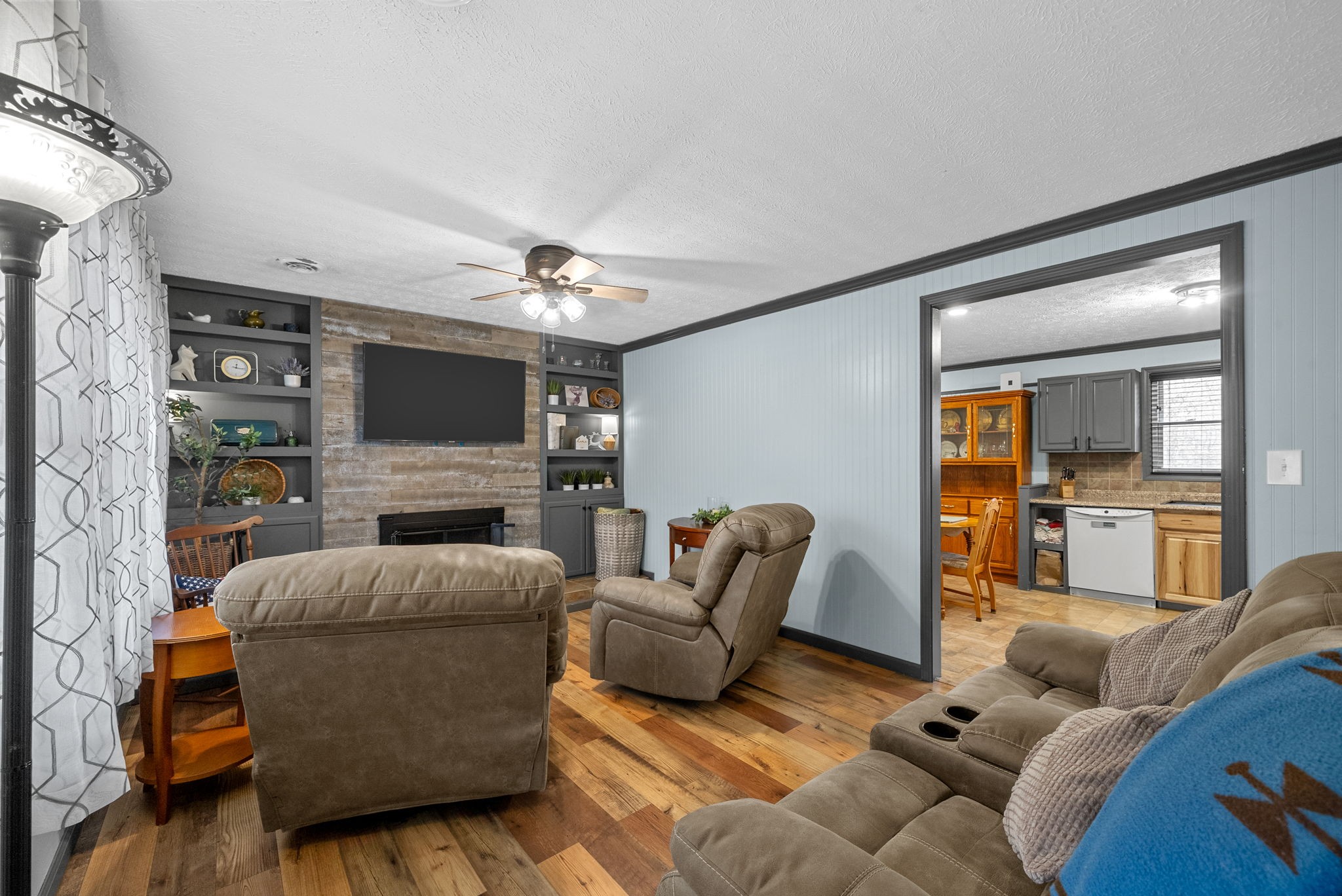 2126 Foster Road Cumberland Furnace, TN 37051 - Photo 10 of 42 a living room with furniture and a flat screen tv
