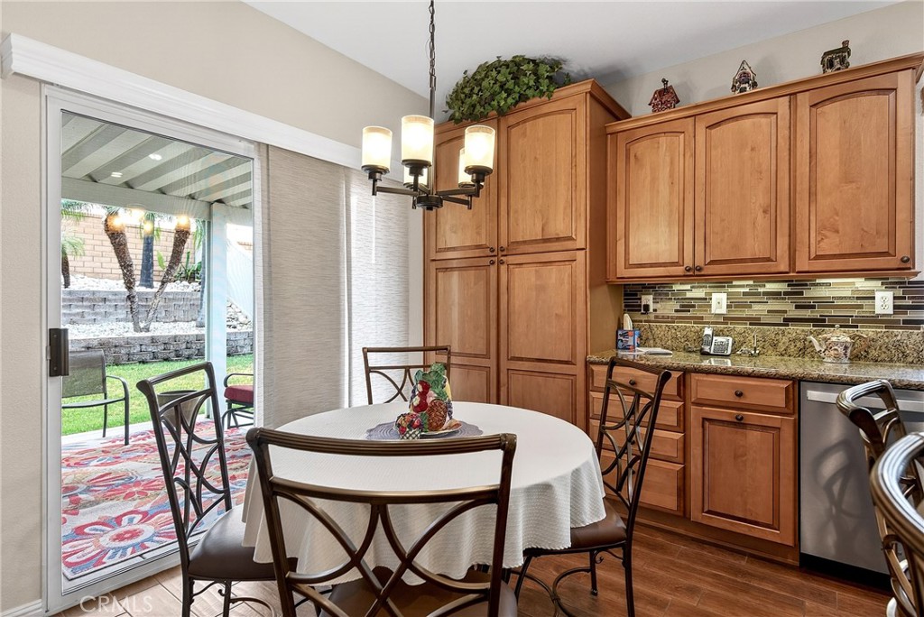7619 Vista Rio Road Highland, CA 92346 - Photo 14 of 25 a view of a dining room with furniture window and wooden floor