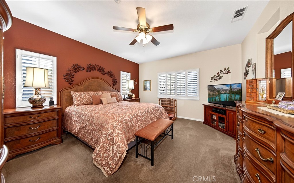 7619 Vista Rio Road Highland, CA 92346 - Photo 15 of 25 a bedroom with a bed and a flat screen television