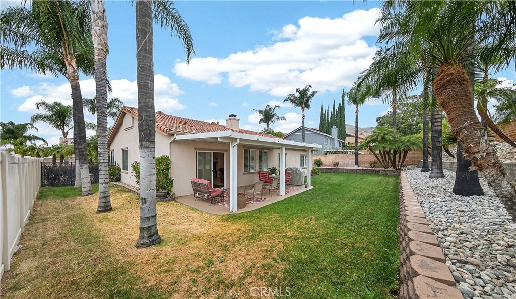 7619 Vista Rio Road Highland, CA 92346 - Photo 22 of 25 a front view of a house with garden