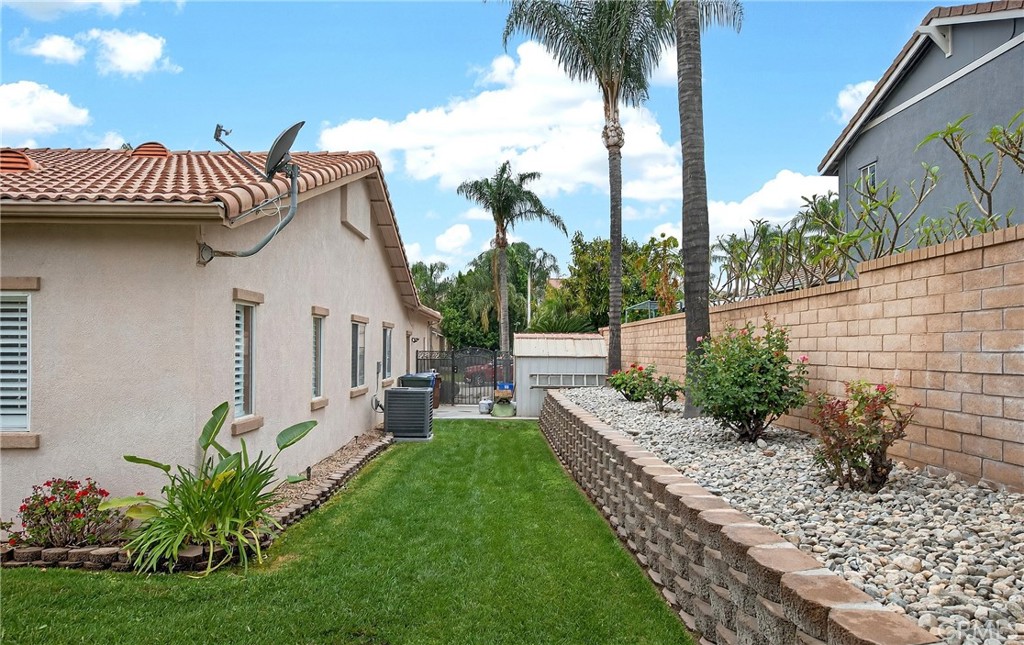 7619 Vista Rio Road Highland, CA 92346 - Photo 25 of 25 a view of a house with a yard and furniture