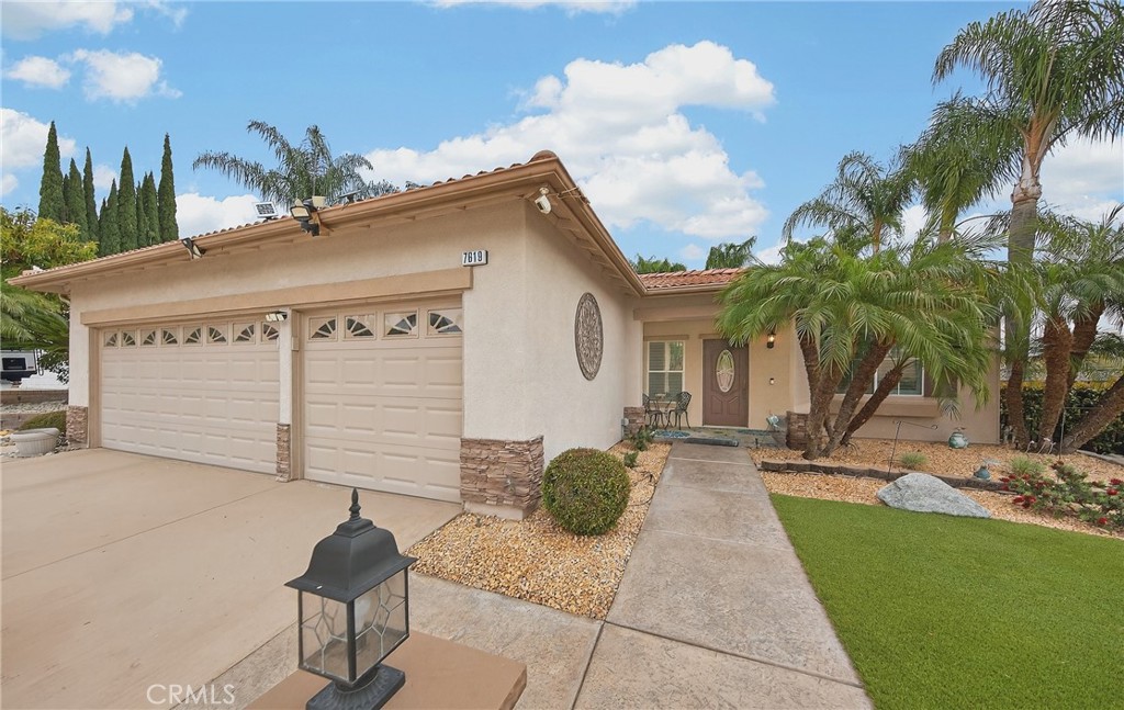 7619 Vista Rio Road Highland, CA 92346 - Photo 5 of 25 a front view of a house with garden