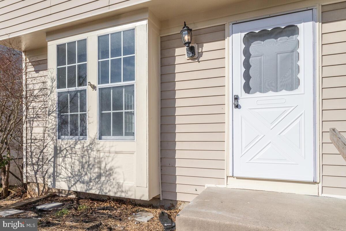 1308 Apple Ridge Court Edgewood, MD 21040 - Photo 4 of 38 a view of a door house with a small porch