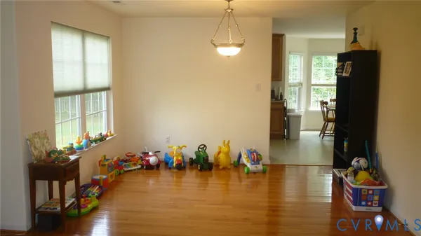 a view of a living room and dining room
