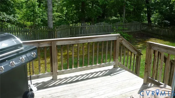 a view of deck with wooden floor and outdoor seating