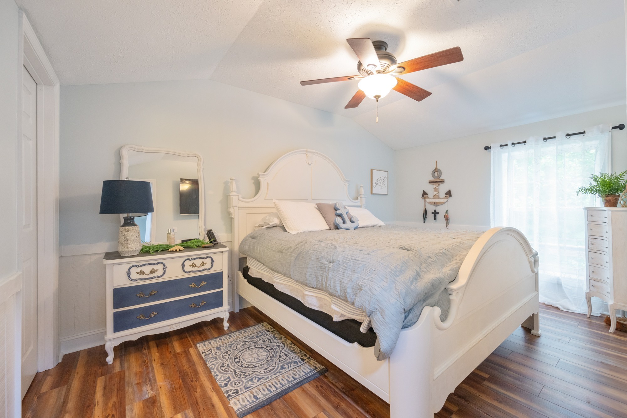 91 Creekside View Lane Decaturville, TN 38329 - Photo 11 of 57 a bedroom with a bed and a ceiling fan