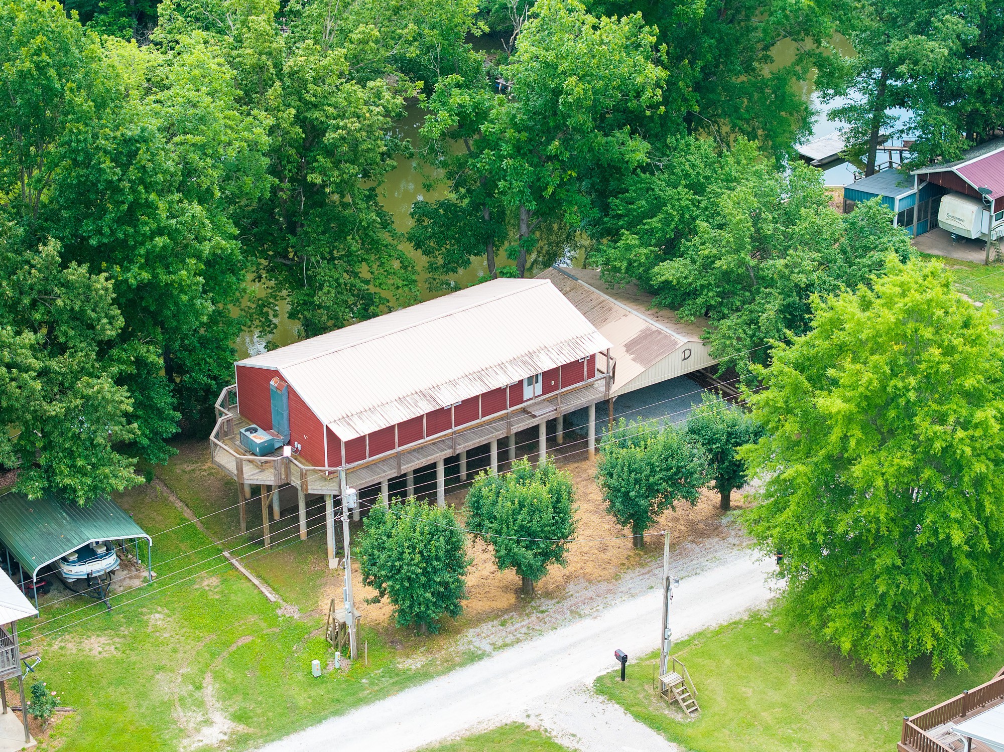 91 Creekside View Lane Decaturville, TN 38329 - Photo 20 of 57 a aerial view of a house with swimming pool next to a big yard