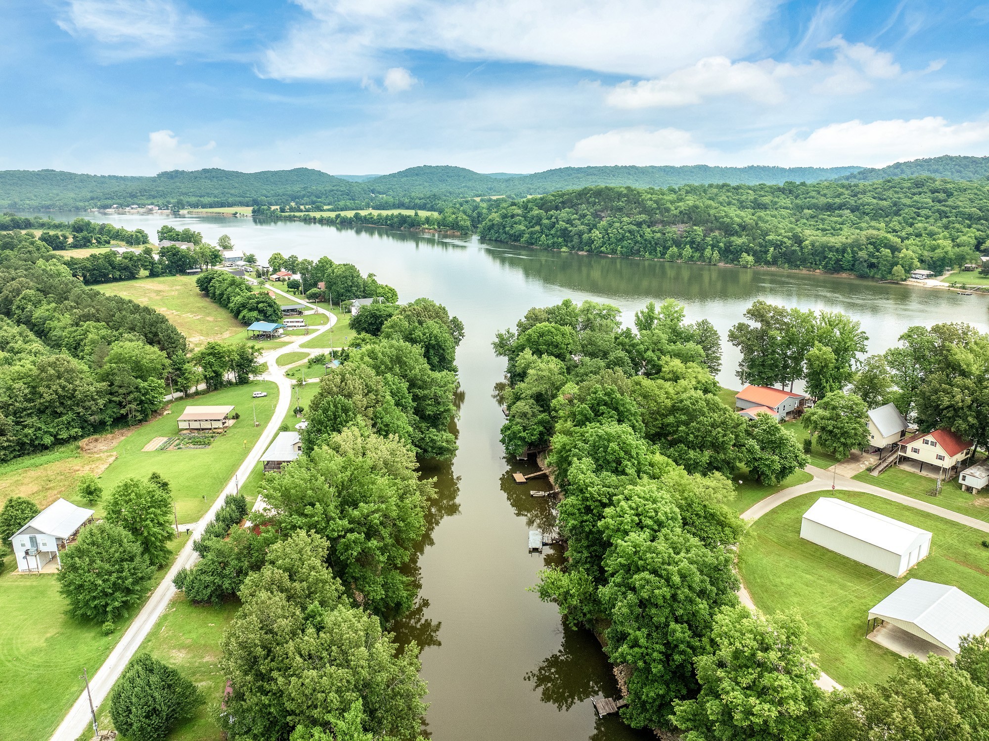 91 Creekside View Lane Decaturville, TN 38329 - Photo 30 of 57 a view of a lake with a city