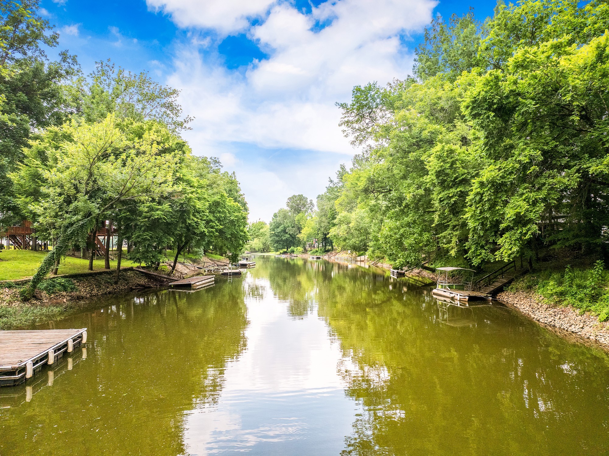 91 Creekside View Lane Decaturville, TN 38329 - Photo 31 of 57 a view of a lake with houses in the background
