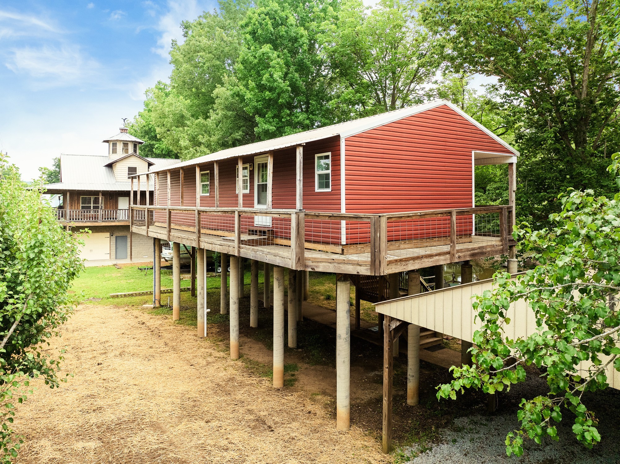 91 Creekside View Lane Decaturville, TN 38329 - Photo 35 of 57 a view of a house with a yard and sitting area