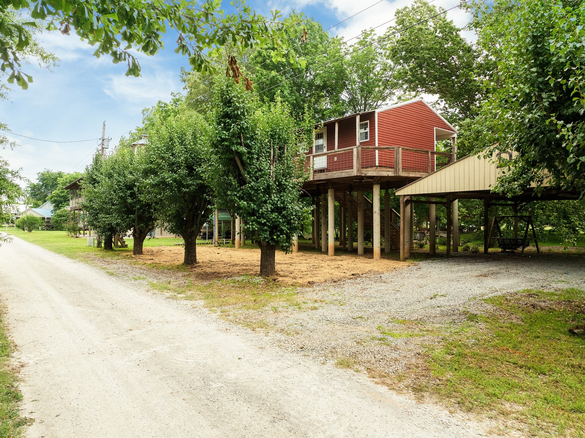 91 Creekside View Lane Decaturville, TN 38329 - Photo 36 of 57 a front view of a house with a yard