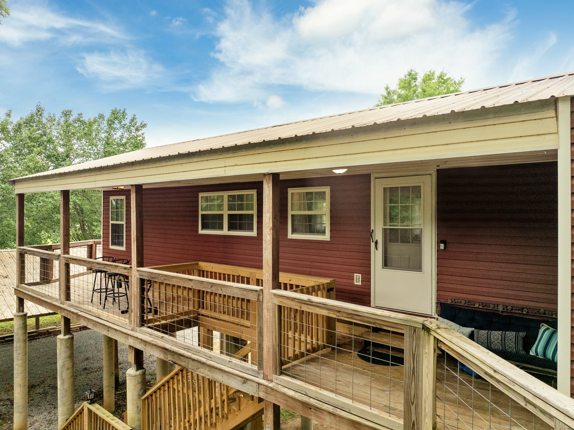 91 Creekside View Lane Decaturville, TN 38329 - Photo 39 of 57 a view of a house with a balcony