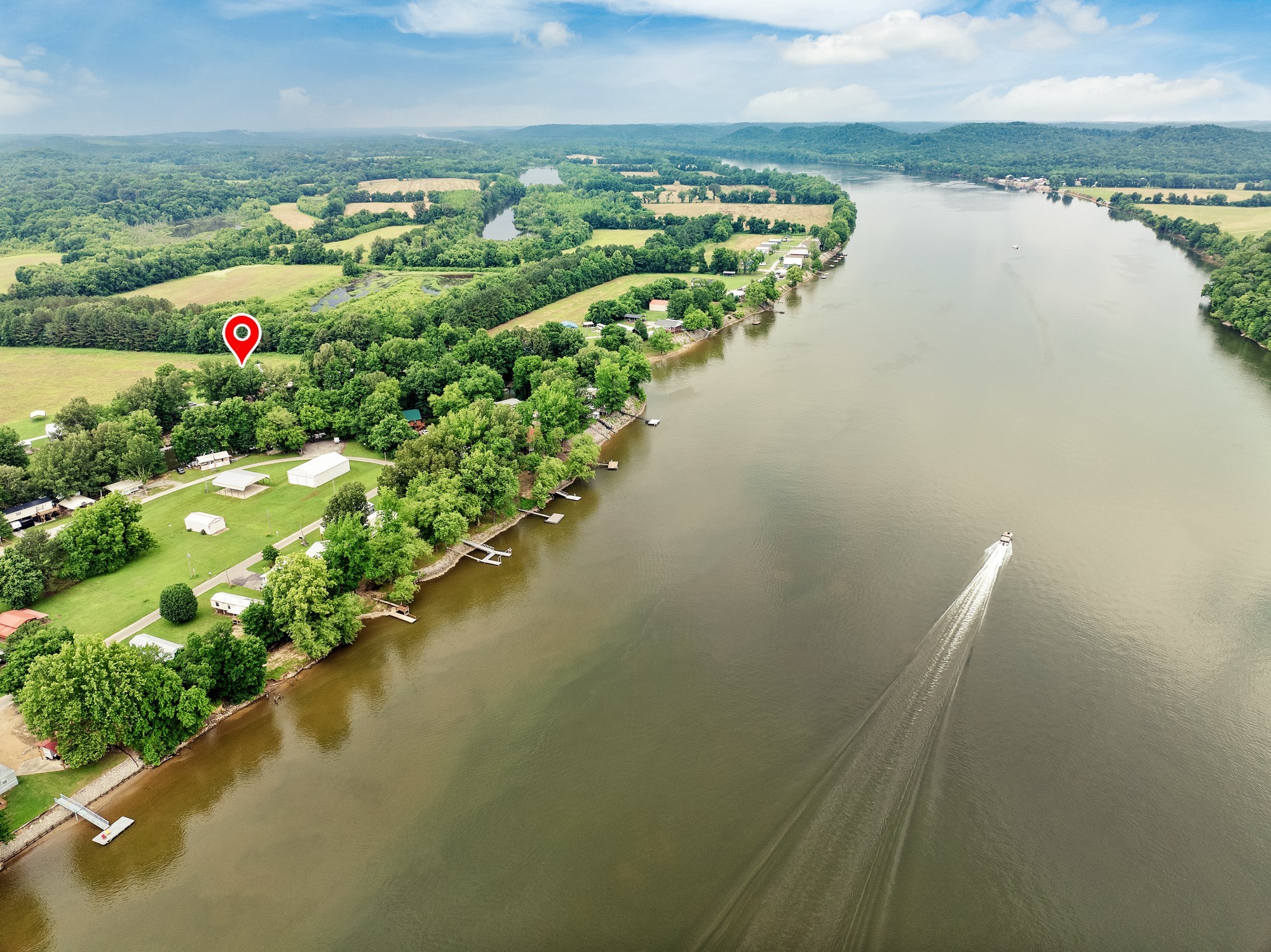 91 Creekside View Lane Decaturville, TN 38329 - Photo 40 of 57 a view of a lake with a city