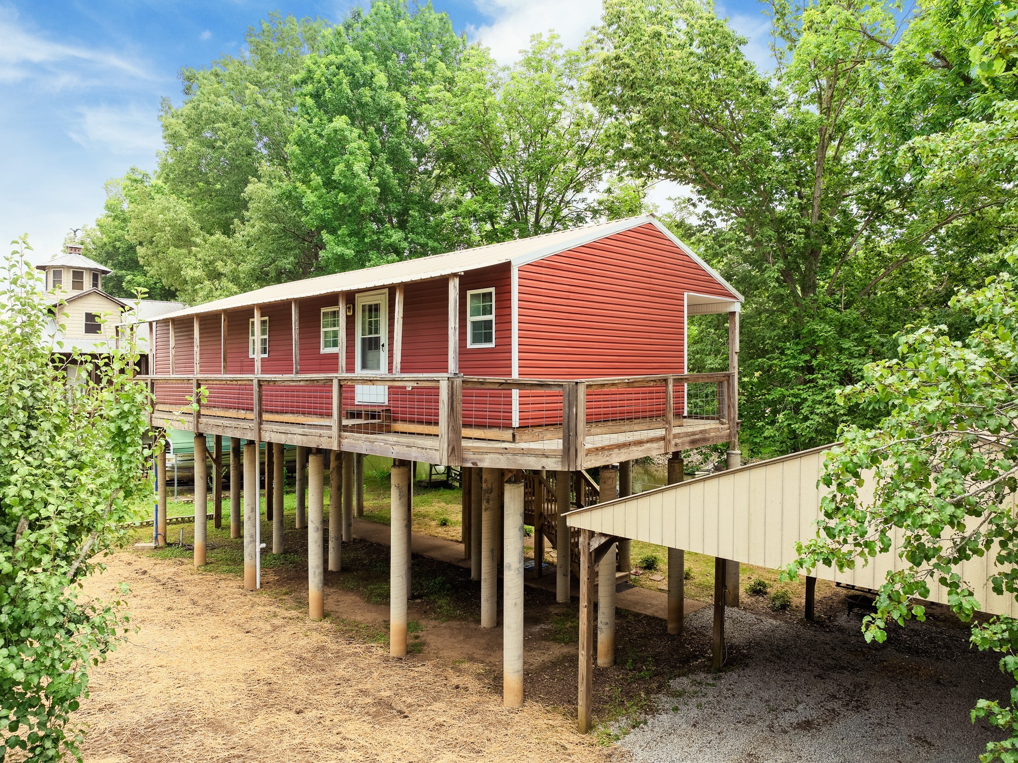 91 Creekside View Lane Decaturville, TN 38329 - Photo 5 of 57 a backyard of a house with table and chairs