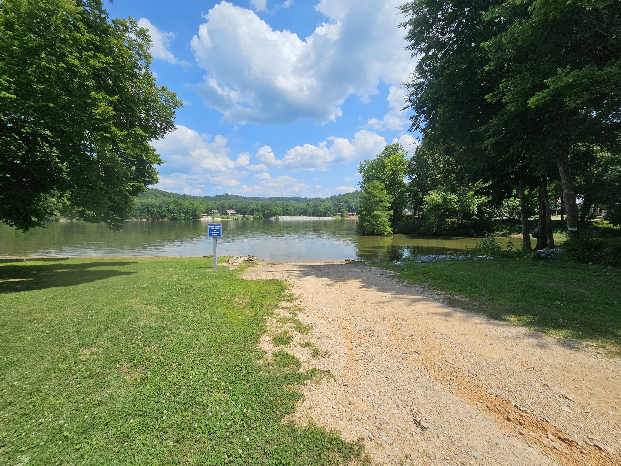 91 Creekside View Lane Decaturville, TN 38329 - Photo 57 of 57 a view of a lake with a big yard
