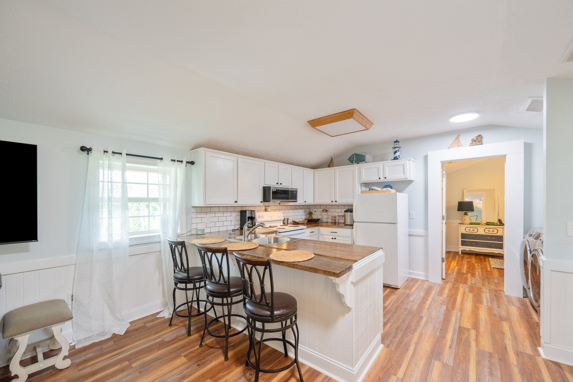 91 Creekside View Lane Decaturville, TN 38329 - Photo 6 of 57 a kitchen with a table chairs refrigerator and cabinets