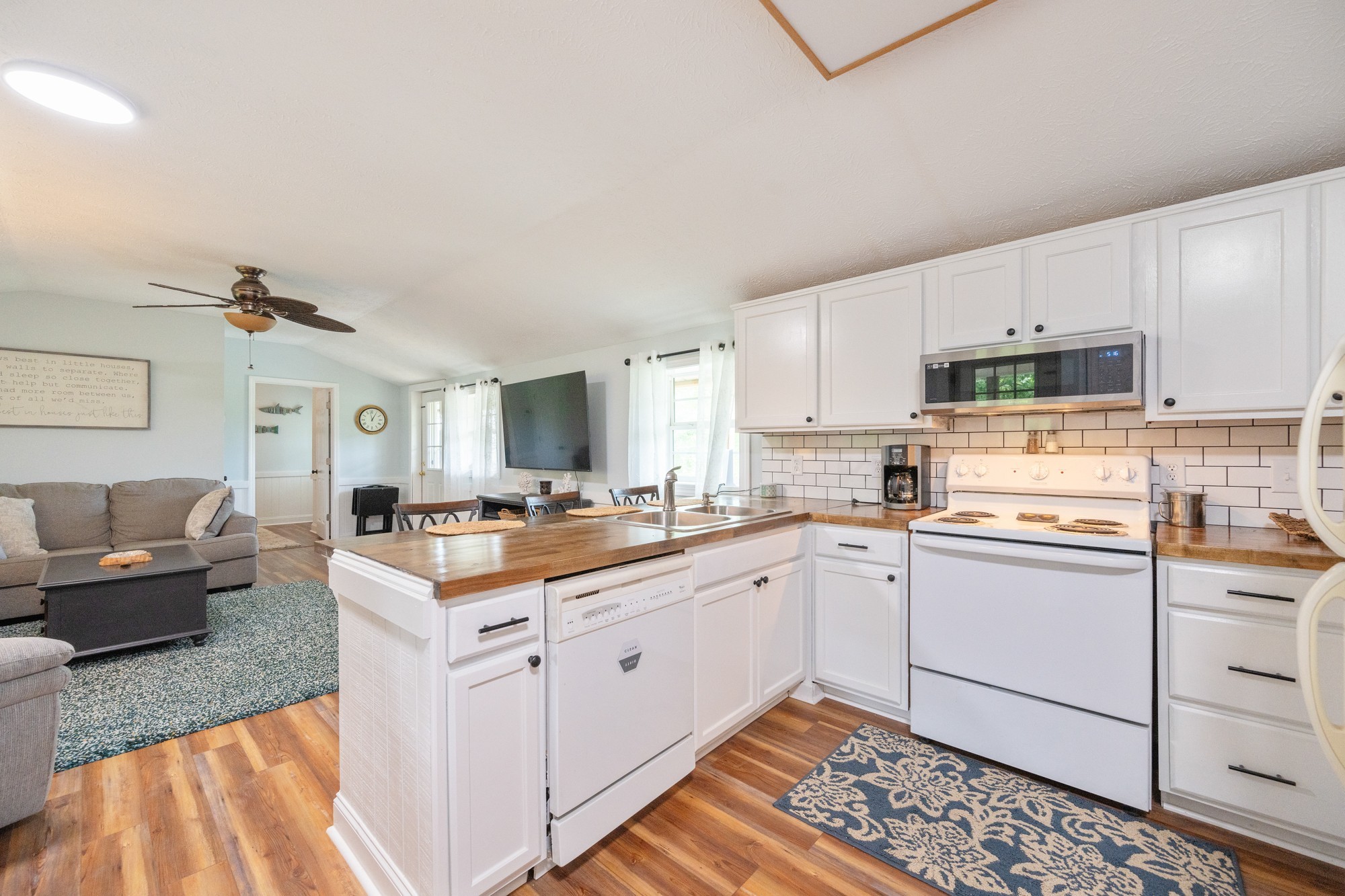 91 Creekside View Lane Decaturville, TN 38329 - Photo 7 of 57 a kitchen with a sink stove and cabinets