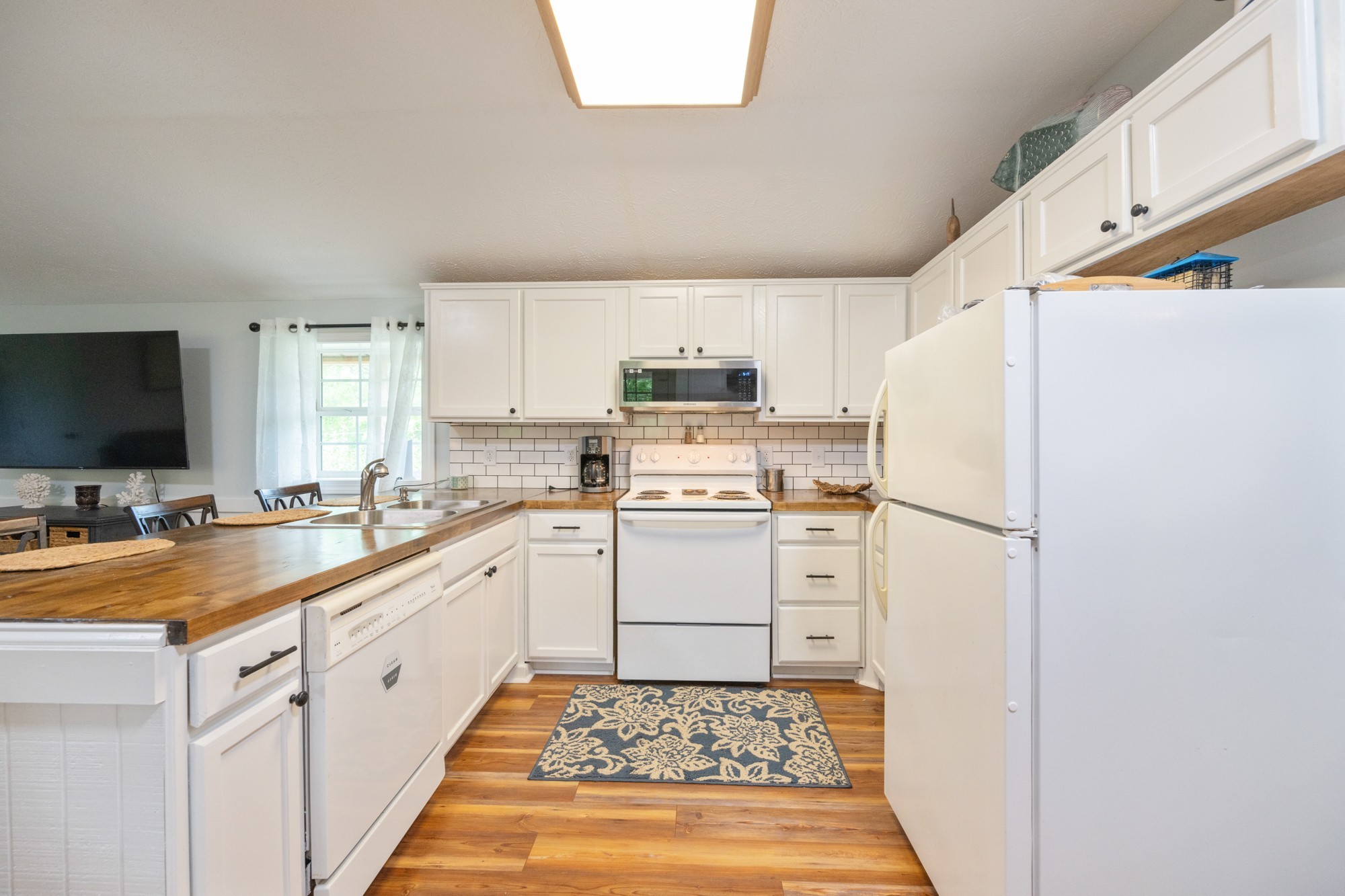 91 Creekside View Lane Decaturville, TN 38329 - Photo 8 of 57 a kitchen with a sink stove and refrigerator