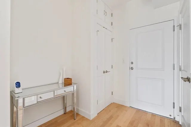a view of storage and utility room with closet