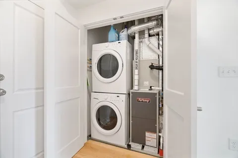 a view of a hallway with washer and dryer
