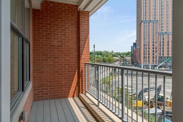 a view of a balcony with wooden floor