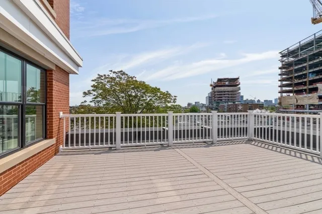 a view of a balcony with wooden floor