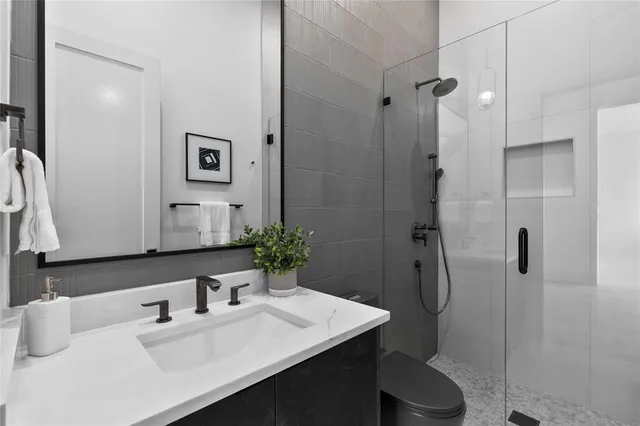 a living room with furniture and a ceiling fan