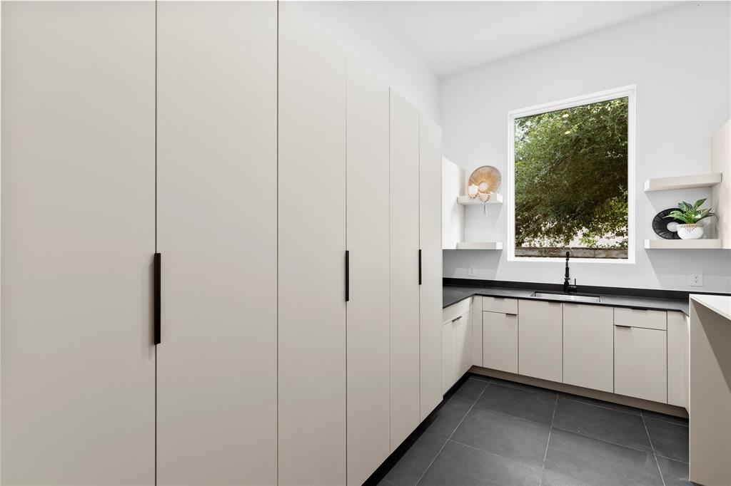 11232 Hillcrest Road Dallas, TX 75230 - Photo 17 of 40 a kitchen with granite countertop a sink and a window