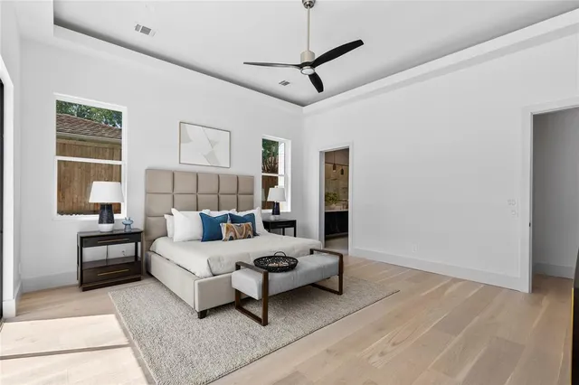 a living room with furniture and large windows