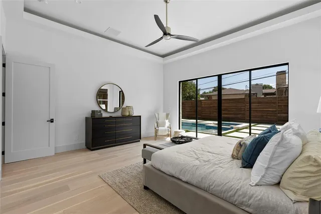 a bedroom with a bed couch and window